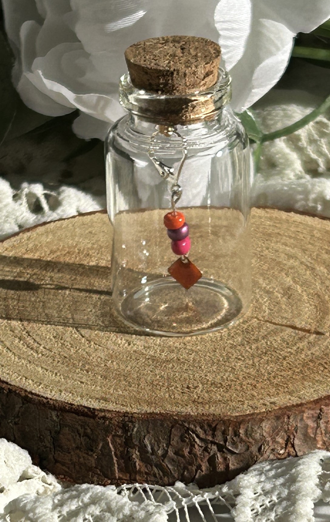 Camille Loop | Single earring in a jar